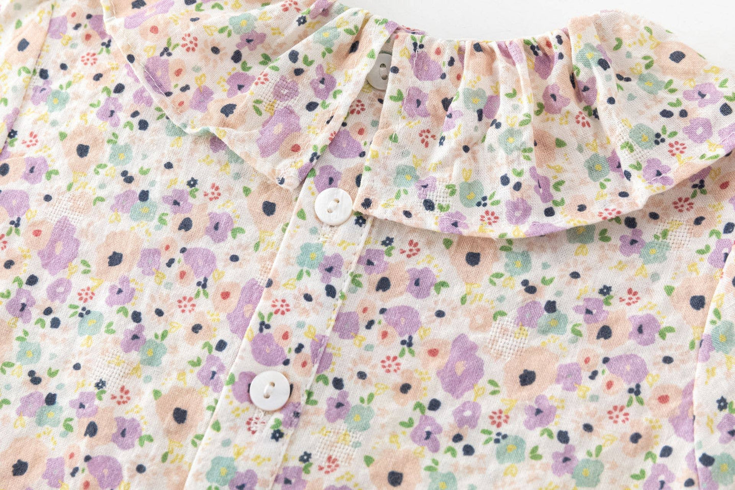 Blusa a maniche lunghe con colletto volant per neonata