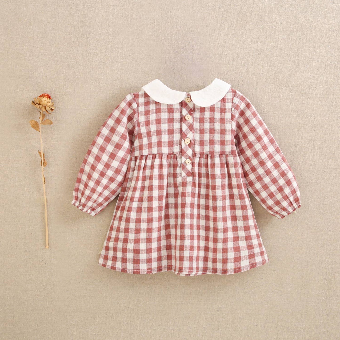 Vestito rosa per bebè a quadretti Vichy con colletto ricamato