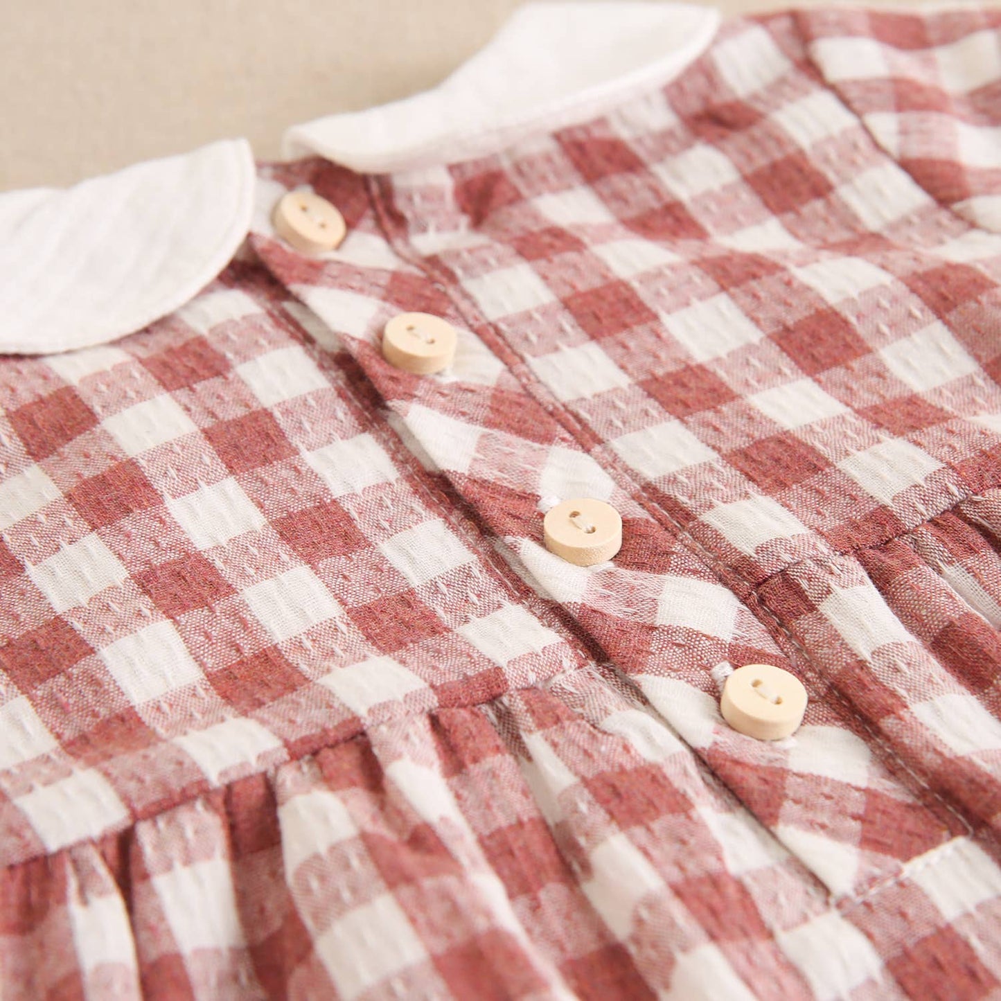 Vestito rosa per bebè a quadretti Vichy con colletto ricamato