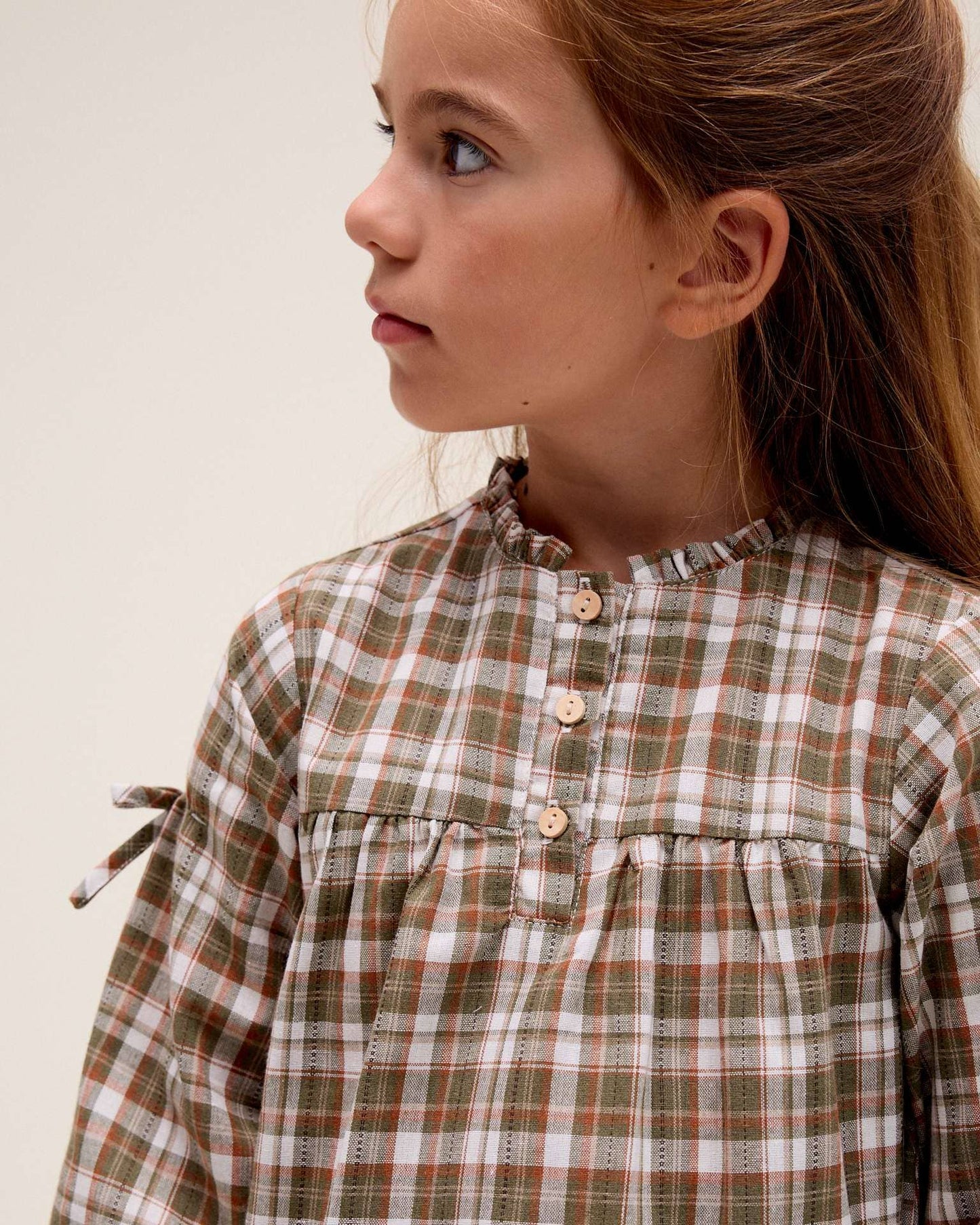 Vestito a quadri marroni e verdi